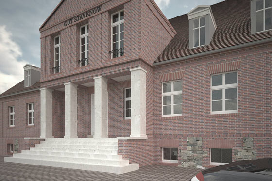 Das neue Portal aus Travertin kontrastiert zum Altbau aus Backstein.